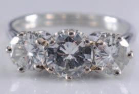 brilliant-cut diamonds, each approximately 0.8cts. 1200-1500 238.