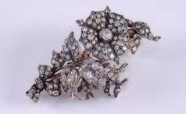 flower head buds, leaves and ribbon pave-set with old brilliant-cut diamonds estimated