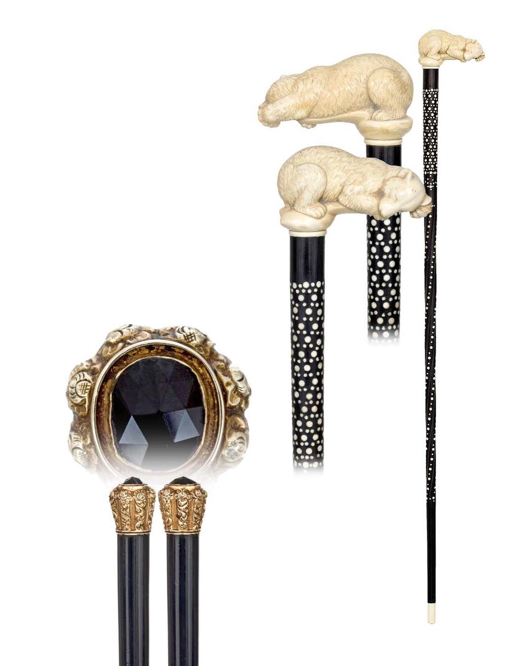 39. Spectacular Ivory Bear Cane English, 19th Century-A large ivory slumbering bear handle on an ebony shaft carved with a twist and studded with ivory dot inlay and fitted with an ivory collar and