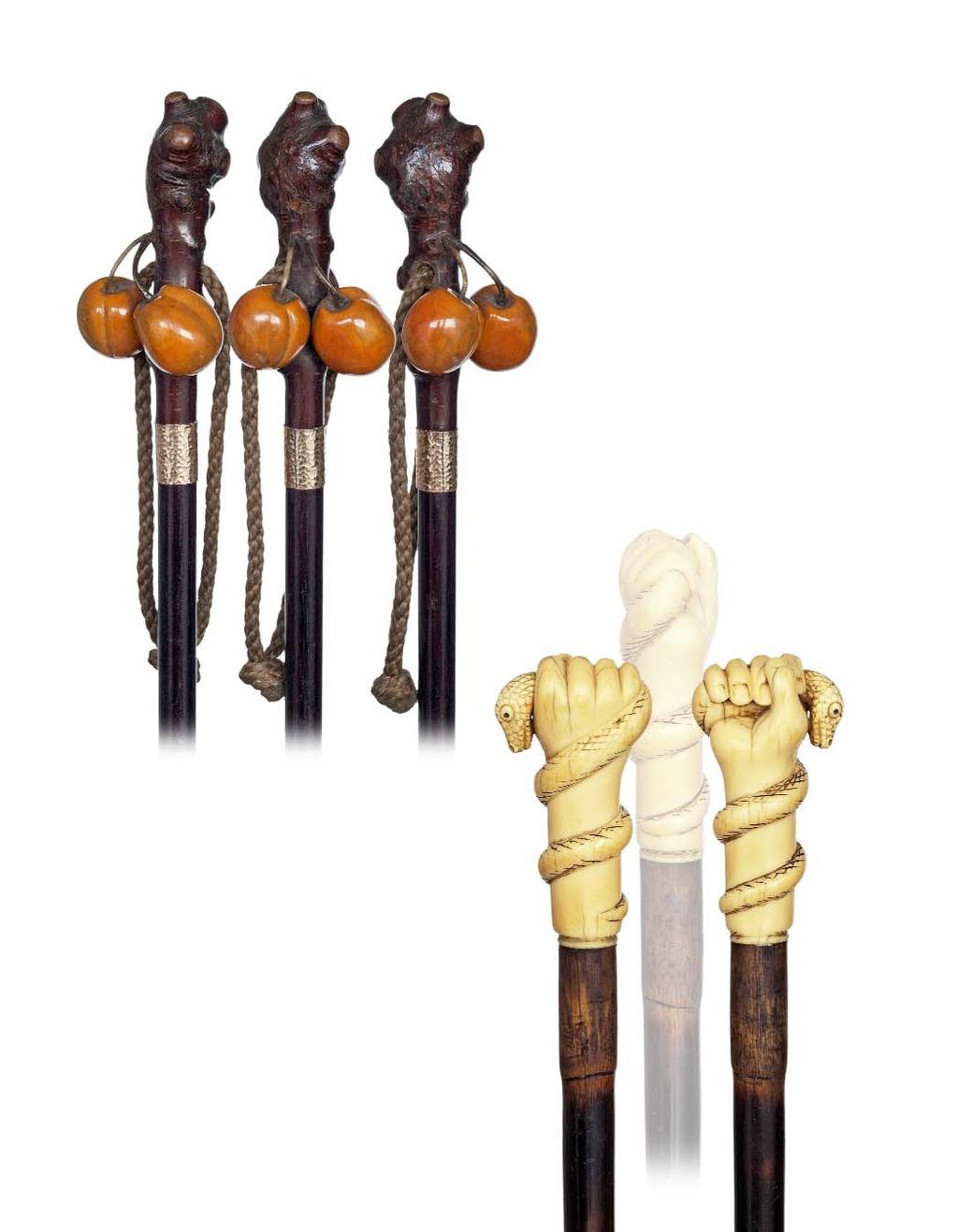 121. Countryside cane French, late 19th Century- Fruit wood branch handle with two attached and substantial hardstone apricots, braided loop, ebony shaft with silver gilt collar and a metal ferrule.