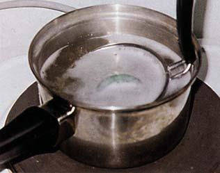 Figure 24. A process commonly used to enhance polished jadeite, waxing (or wax dipping ) is actually a simple procedure.