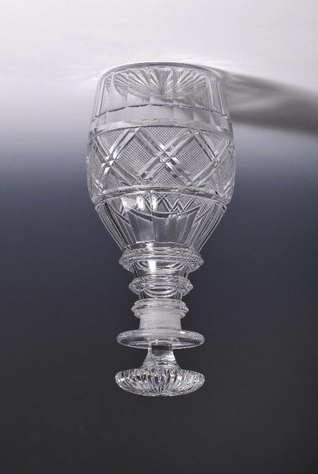 19th Century Decanters No. 371 $575 George III decanter, mushroom stopper, three triple neck rings, club body, cut tartan motif central band, flutes above and below, radial prism base.