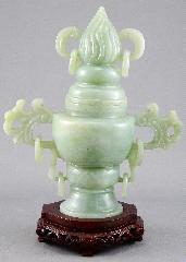 425 Oriental carved jade covered urn with ring decoration on a