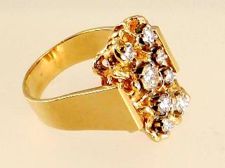 $1,200 - $1,600 14k yellow gold and diamond ring.