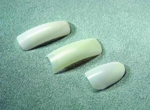 Buff lightly over nail plate with medium/fine (180-grit or higher) abrasive to remove natural oil. Remove the dust with nail brush. 5. Size tips.