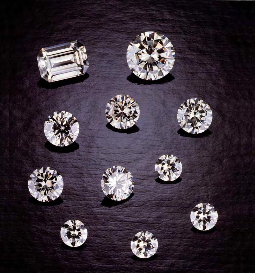 Figure 1. Near-colorless synthetic moissanite is being marketed for jewelry purposes as a diamond imitation. The faceted pieces shown here, weighing from 0.09 to 0.