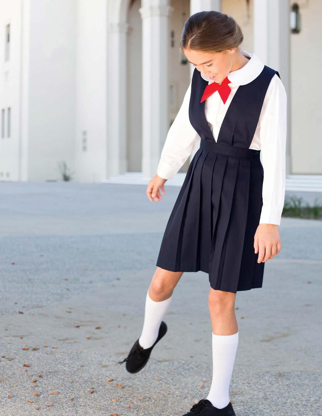have some school fun This classic skirt jumper with a v-neck shape has baked-in pretty knife pleats all around. Easy to dress and iron free.