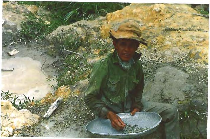 4 Figure 10. For the most part at n Quy Chau, the miners wash the gravels by hand using rudimentary "pans" in their search for rubies and other gem mterials. photo by C. ~ora.