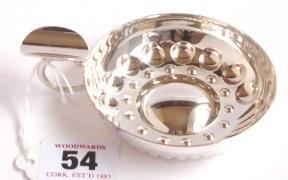 taster decoratively embossed and having ring handle and finger rest by
