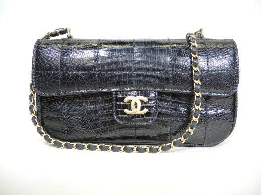 CHANEL 2002 Black Lizard Mini Cross body Flap Purse Sold in one day for $1500. 03/24/18 Exotic and compact, this mini bag is a classic and edgy piece that will go with everything!