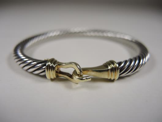 DAVID YURMAN Sterling and 14K Medium 5mm Classic Cable Buckle Bracelet Retailed for $750, sold in one day for $399.