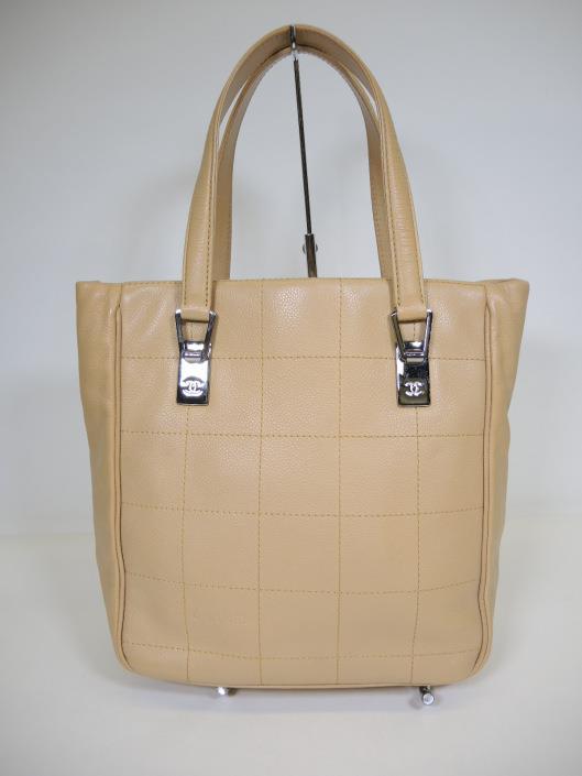 CHANEL Tan Square Stitch Tote Sold on one day for $1,000. 03/10/18 A small tote that is perfect for the tailored and feminine style.