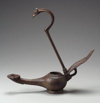 Figure 1.2: Hanging lamp with leaf handle and griffin-head hook. Nubian, Meroitic Period, reign of Takideamani, A.D. 140 155. Object Place: Sudan, Nubia. Bronze. Overall: 65.