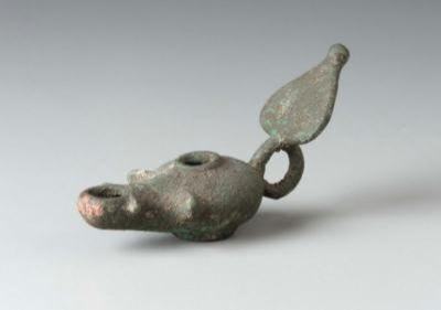 629) Figure 4.4: Lamp. Roman. Bronze. Length: 9.8 cm (3 7/8 in.). Museum of Fine Arts, Boston.