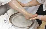 Apply in a circular, upward motion onto the feet and up the legs. Add water to emulsify pedi scrub as desired.