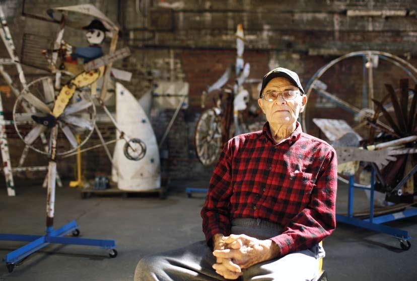 Before whirligigs, Vollis Simpson discovered his talent in World War II when he built a waterwheel-like industrial washing machine that used the ocean. The aging artist props himself up with a walker.