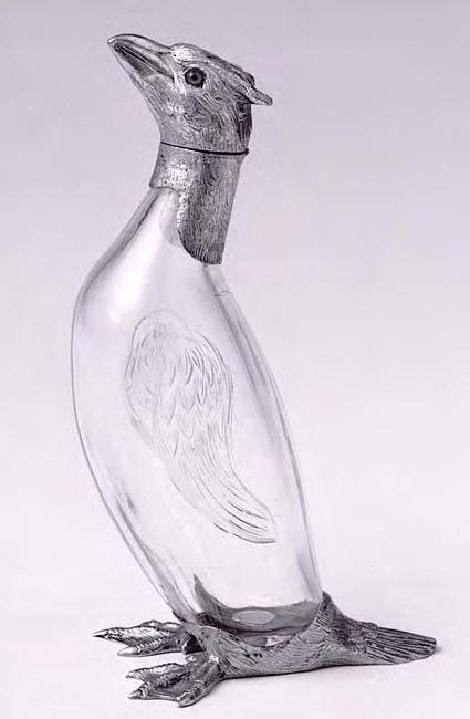 33. A silver gilt perfume bottle with carved glass body in the form