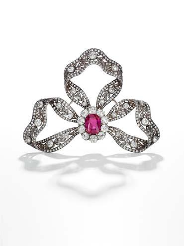 Boasting the same prestigious provenance are a magnificent diamond bow brooch, adorned with a 6.89-carat Burmese ruby (est.