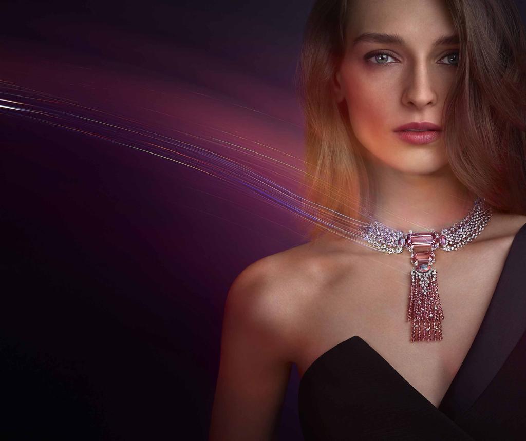 The full version of the YOSHINO Necklace worn on a model. It is in 18K white gold, set with two emerald-cut morganites (55.18 carats), three cabochon-cut opals (8.