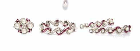 244 244* A Set of Platinum, Gold, Ruby, Diamond and Cultured Pearl Jewelry, French, in a repeated S-curve motif, consisting of a necklace, the front comprised of sections alternately set with