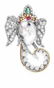 248 An 18 Karat Yellow and White Gold, Pearl, Diamond and Multi Gem Elephant Brooch, Enrico Seraini, depicting a stylized elephant head with ears, trunk and tusks wearing a crown like headpiece,