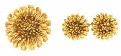 259* An 18 Karat Yellow Gold Flower Demi Parure, consisting of a sculpted brooch composed of two multi petal layers surrounding the freeform stamen, together with a pair of matching earclips.