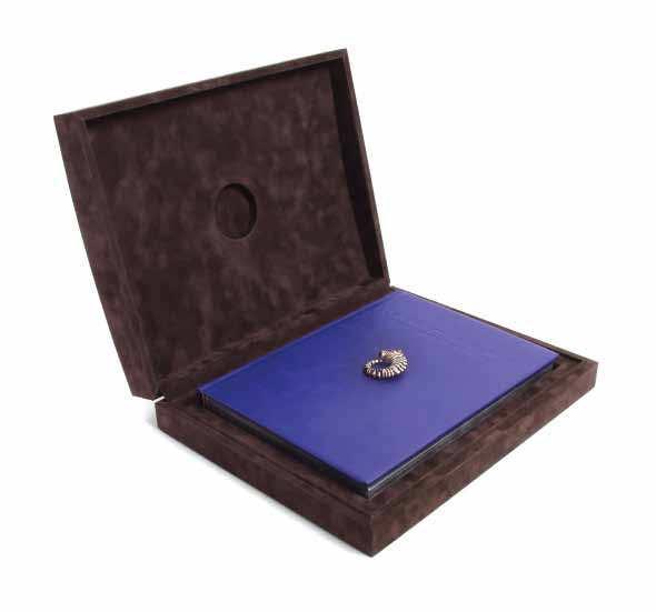 Accompanied by a signed brown suede pouch for the pendant, the outer cardboard box for