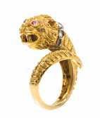 290 288 289 288* A Yellow Gold, Diamond and Ruby Lion Ring, Greek, in a bypass design, the sculpted head containing two round mixed cut ruby eyes and ive rose cut diamonds.