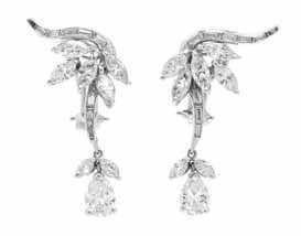 308 307 306 306* A Pair of Platinum and Diamond Earclips, in a stylized foliate motif, the lowering branch tops and hinged drop pendants containing 14 marquise cut diamonds weighing approximately 2.