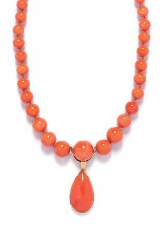334 A Graduated Coral Bead and Yellow Gold Necklace and Pendant, consisting of a strand containing 38 mottled orange coral beads measuring approximately 8.60-20.