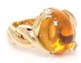 $1,500-2,500 338* An 18 Karat Yellow Gold, Citrine and Diamond Ring, Chanel, containing one cabochon cut citrine measuring 15.86 x 11.92 x 9.