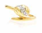 364 362 363 362* An 18 Karat Yellow Gold and Diamond Ring, Cartier, the bypass design containing six round brilliant cut diamonds weighing approximately 0.03 carat total. Stamp: 195675 Cartier 750. 2.