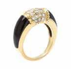 Hand Inscribed: VCA 18KT 81303A6 OCT 37. 7.90 dwts. $3,000-5,000 411* An 18 Karat Yellow Gold, Onyx, and Diamond Ring containing numerous round brilliant cut diamonds weighing approximately 0.