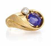 $600-800 415* A Yellow Gold, Tanzanite and Diamond Ring, containing one claw prong set cushion cut tanzanite weighing approximately 6.