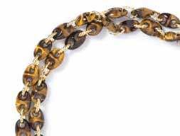 449 An 18 Karat Yellow Gold and Tiger s Eye Quartz Necklace, French, consisting of carved tiger s eye marine links joined with rope texture oval gold links. Stamp: 18K FRANCE (maker s mark). 30.