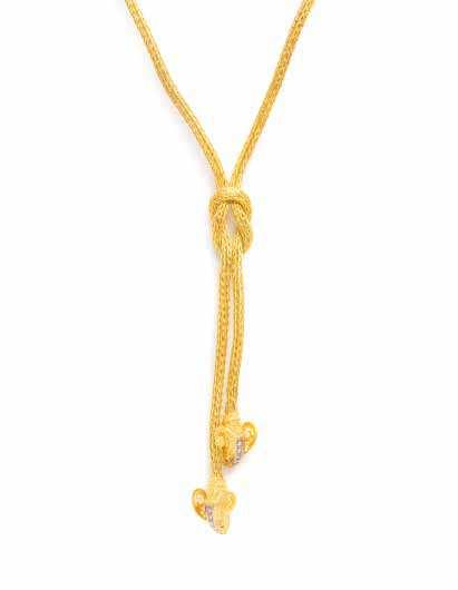 531 529 530 529* An 18 Karat Yellow Gold, Diamond and Ruby Ram s Head Demi Parure, consisting of a meshwork chain with a central knotted design extending to the intricately engraved and textured gold