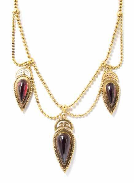 19 An Antique Yellow Gold and Garnet Swag Necklace, consisting of three pendants containing drop shape cabochon cut backed garnets measuring from approximately 18.50 x 8.35 mm to 24.00 x 11.