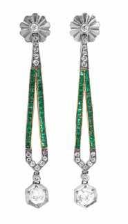 70 A Pair of Art Deco Platinum, Gold, Diamond, and Emerald Earrings, in a drop style, consisting of platinum openwork frames and hinged pendants containing 16 old European and old mine cut diamonds