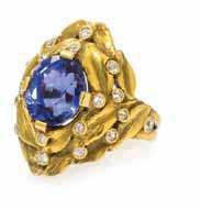 80 An Art Nouveau 18 Karat Yellow Gold, Sapphire and Diamond Ring, in a stylized layered foliate motif, the sculpted gold setting containing one oval mixed cut sapphire measuring approximately 9.