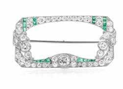 164 A Platinum, Diamond and Emerald Ring, in an openwork design, containing an oval cabochon cut emerald weighing approximately 4.