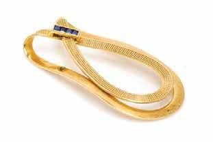 $5,000-7,000 170* An 18 Karat Yellow Gold and Sapphire Money Clip, Hermes, in a loop motif, the top section with engraved geometric texture accented with four channel set square