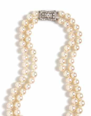 195 194 194 A Double Strand Graduated Cultured Pearl Necklace with Platinum and Diamond Clasp, Raymond Yard, consisting of 82 pearls measuring approximately 7.46-10.