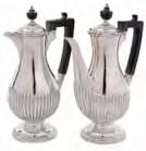 250-300 173 A George V coffee pot of tapered lobed form with bobbin work rim, swept handle on four scrolled supports, 22cm high, maker GW, Sheffield, 1911, also stamped with retailers mark for S.D.