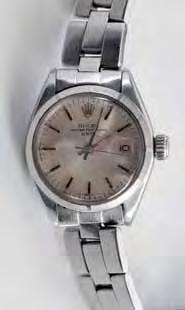 217 218 219 217 Rolex A lady's stainless steel 'Oyster Perpetual Date' wristwatch, the circular satin-finish dial with baton markers, centre seconds and magnified date aperture with 'Rolex' case and
