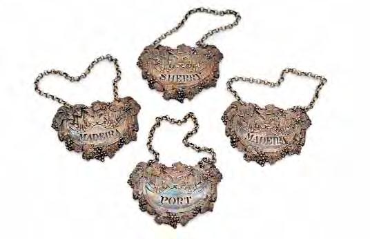 154 A set of four William IV wine labels with stamped fruiting vine borders, the crescent shaped title area pierced with 'Madeira' twice, the other two