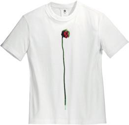 Features a closed bloom flower design on a relaxed all-cotton tee.