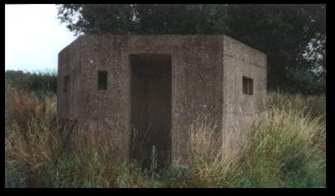 12 Pillboxes are dug-in guard posts, usually made from concrete and equipped with loopholes, through which to fire weapons.