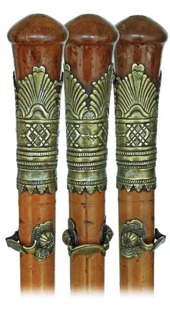 Silver Day Cane Dated September 2, 1899-Modified Derby shaped silver handle modeled with a different Baroque cartouche on each side and fitted with an ebonized malacca shaft and a horn ferrule.