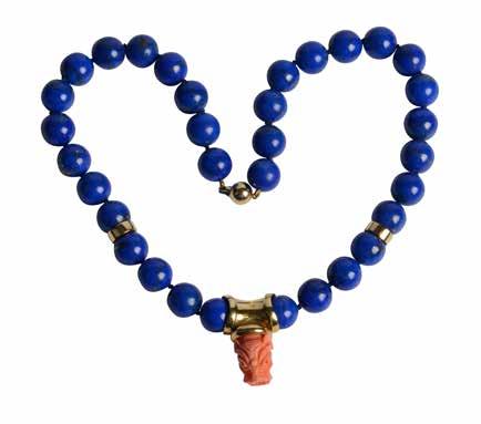 Lot 503 String of lapis beads with carved coral