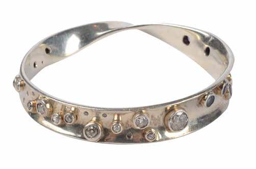 Lot 513 Silver bangle in the Jensen style